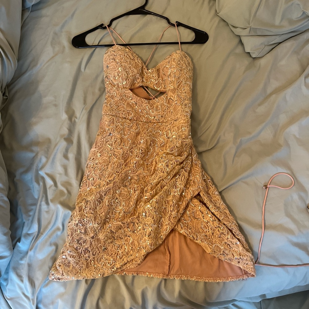 Peach rhinestone dress with adjustable cross back, slit in the front chest area